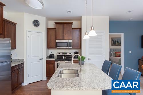 2200 Reserve Circle Harrisonburg, VA 22801 - Photo 7 of 19 a kitchen with stainless steel appliances granite countertop a sink refrigerator and microwave