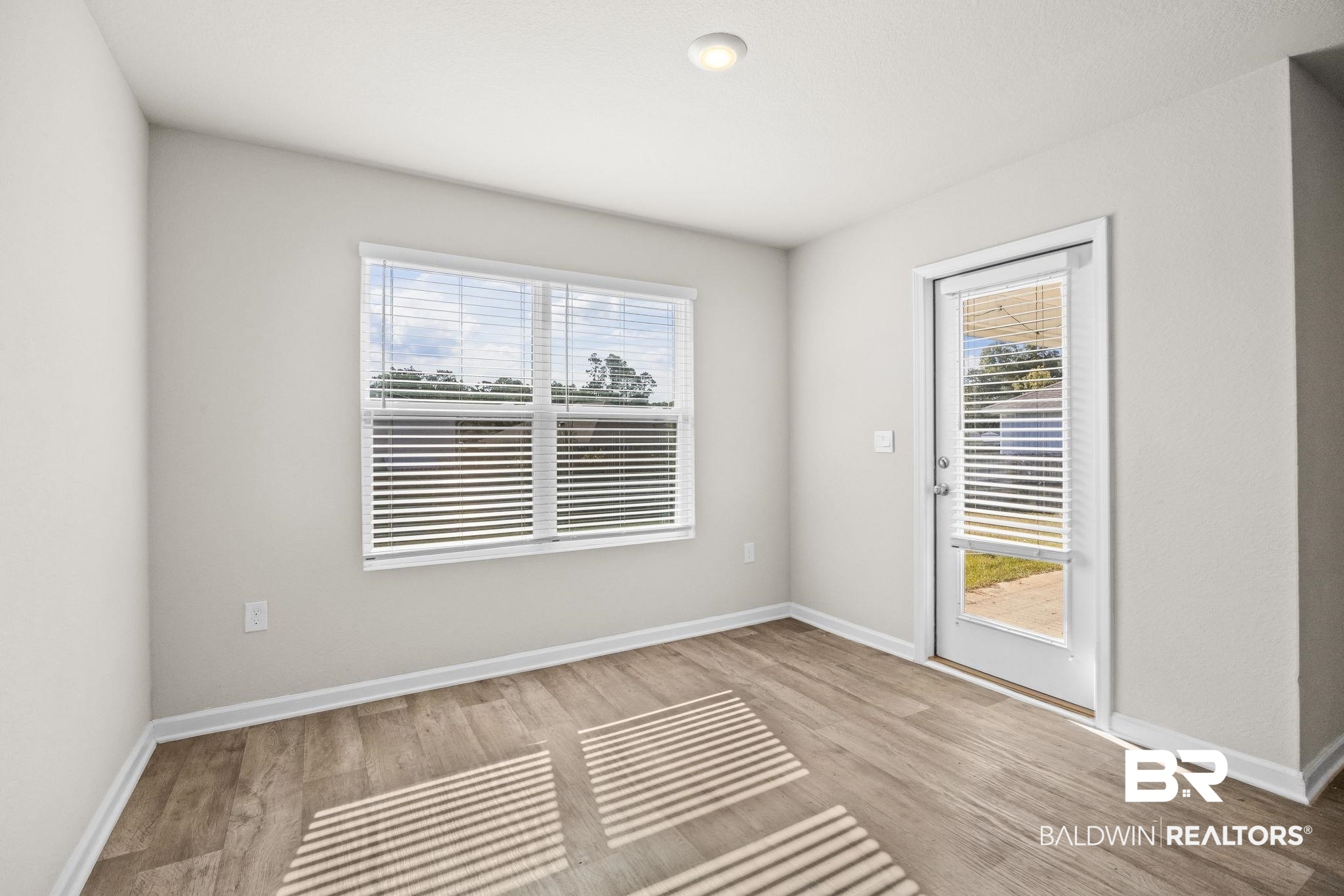 3090 Camino Real Loop Lillian, AL 36549 - Photo 17 of 29 Spare room with baseboards and light wood-style floors