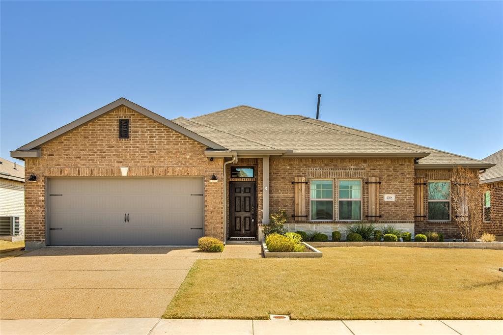 4008 Sparrow Trail Melissa, TX 75454 - Photo 1 of 32 View of front facade with concrete driveway, brick siding, and roof with shingles