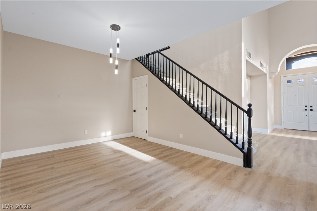 1662 Ravanusa Drive Henderson, NV 89052 - Photo 8 of 74 An inviting foyer showcases an elegant staircase and durable flooring.