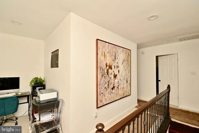 a workspace with furniture and rug