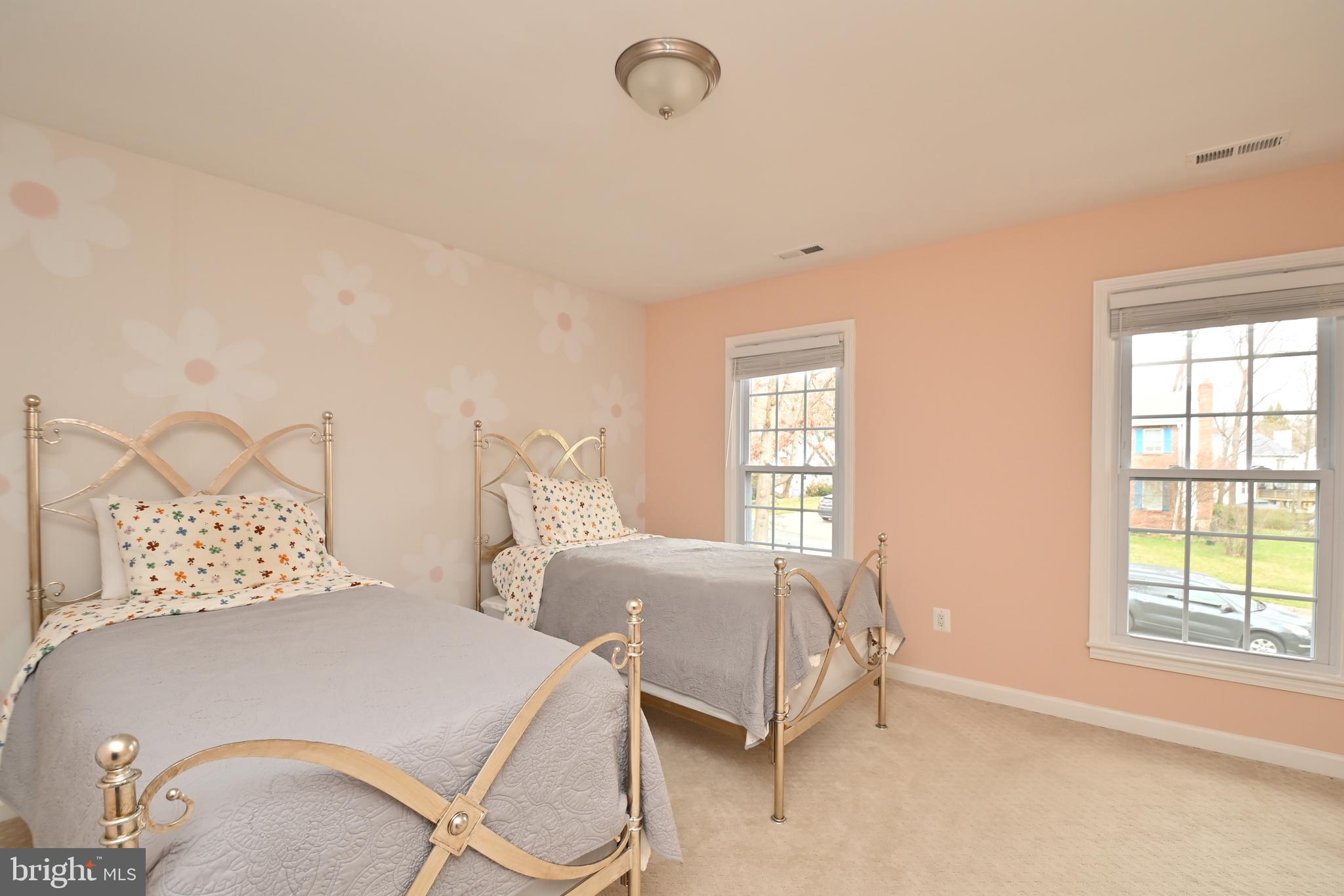 6431 Forest Road Landover, MD 20785 - Photo 26 of 42 a bedroom with two beds and windows