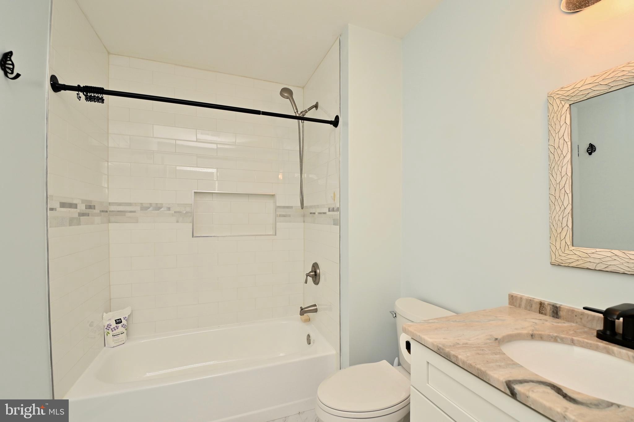 6431 Forest Road Landover, MD 20785 - Photo 29 of 42 a bathroom with a granite countertop sink toilet and shower