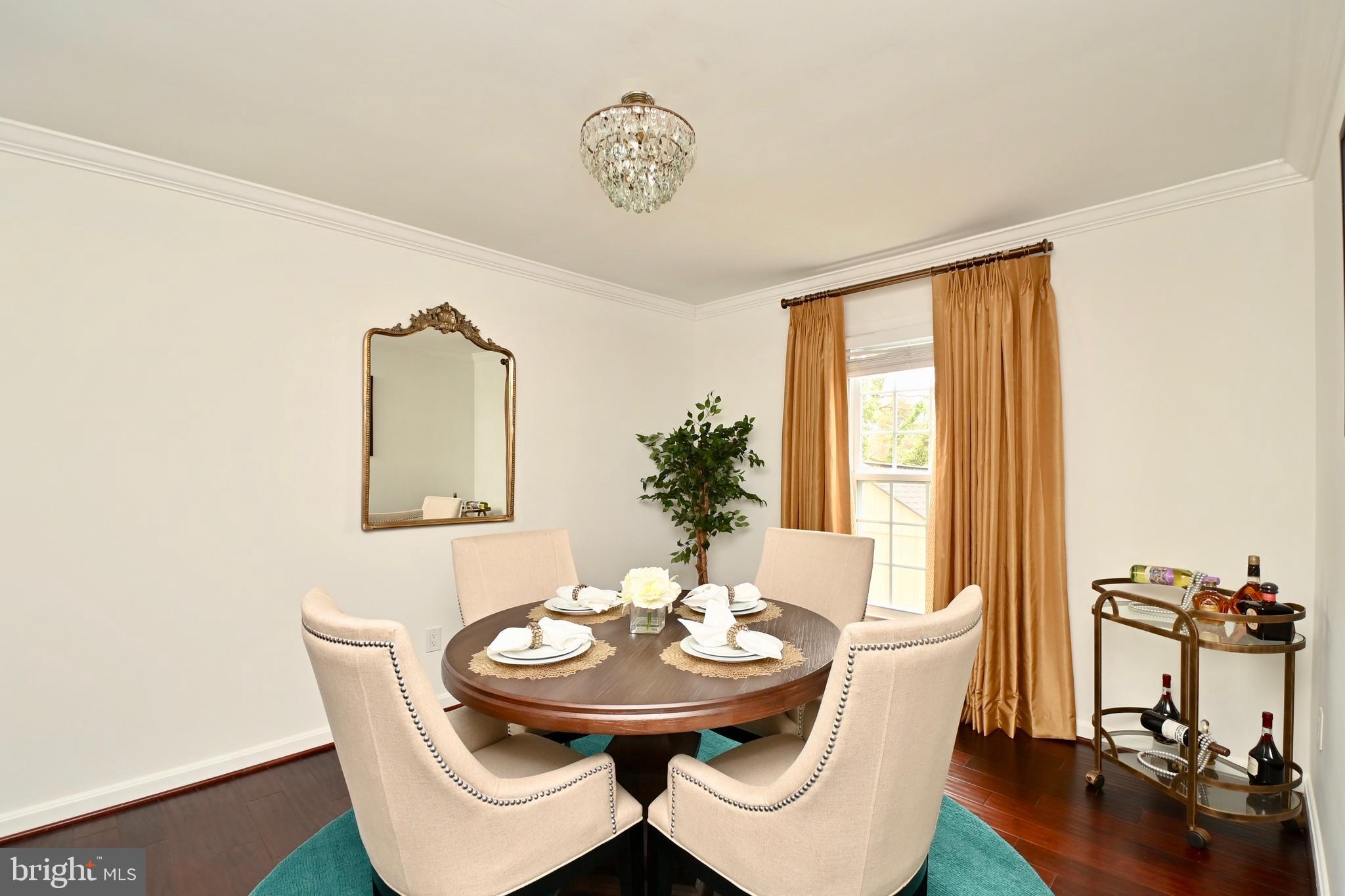 6431 Forest Road Landover, MD 20785 - Photo 7 of 42 a view of a dining room with furniture and wooden floor