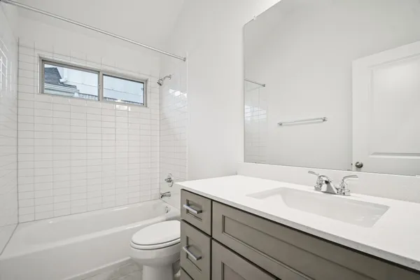 a bathroom with a sink double vanity and shower
