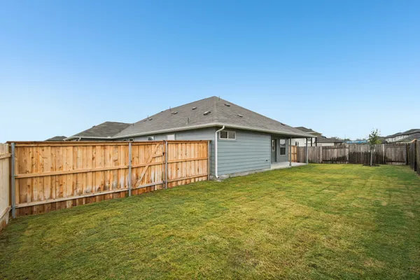a picture of a wall with a white building