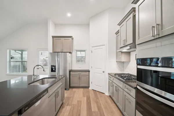 a view of an empty room and a window