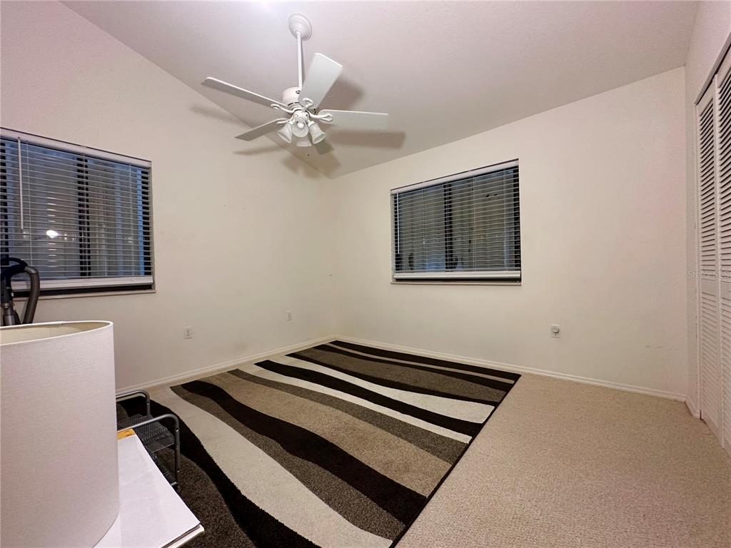 5685 Marina Drive, Unit 4 Sebastian, FL 32958 - Photo 16 of 19 a view of a room with a piano and wooden floor