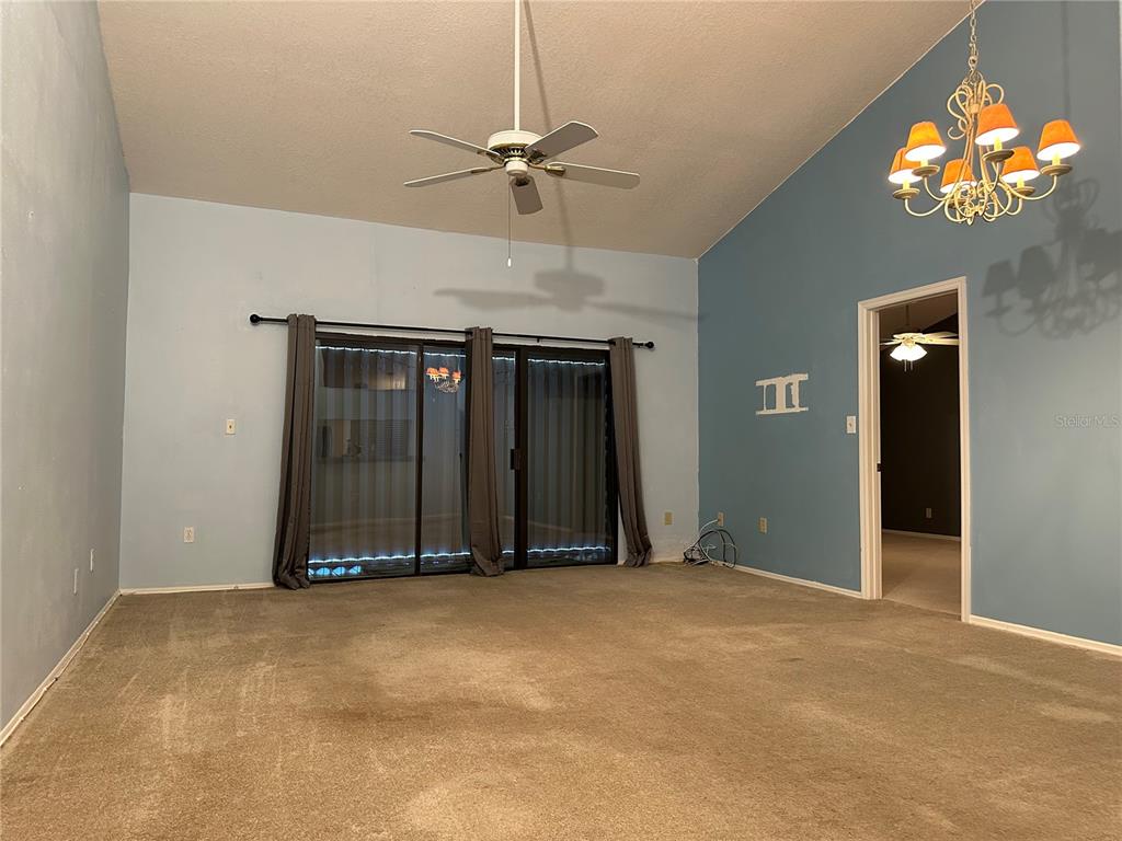 5685 Marina Drive, Unit 4 Sebastian, FL 32958 - Photo 4 of 19 a view of an empty room with a chandelier fan