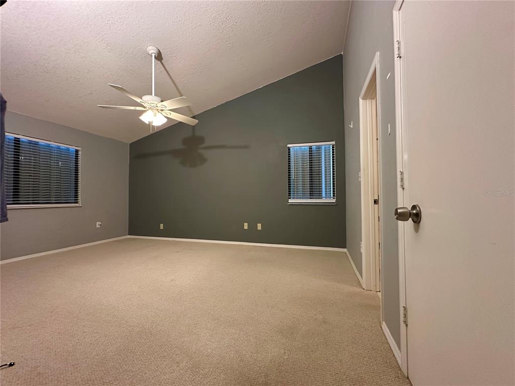 5685 Marina Drive, Unit 4 Sebastian, FL 32958 - Photo 6 of 19 a view of an empty room with a chandelier fan