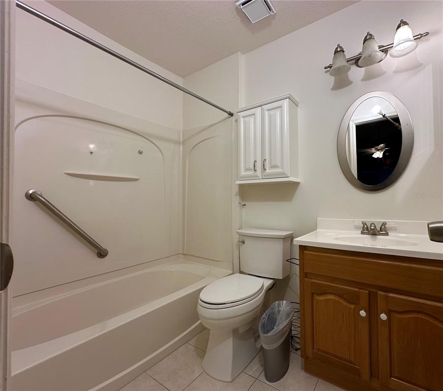 5685 Marina Drive, Unit 4 Sebastian, FL 32958 - Photo 9 of 19 a bathroom with a toilet a sink and a bathtub