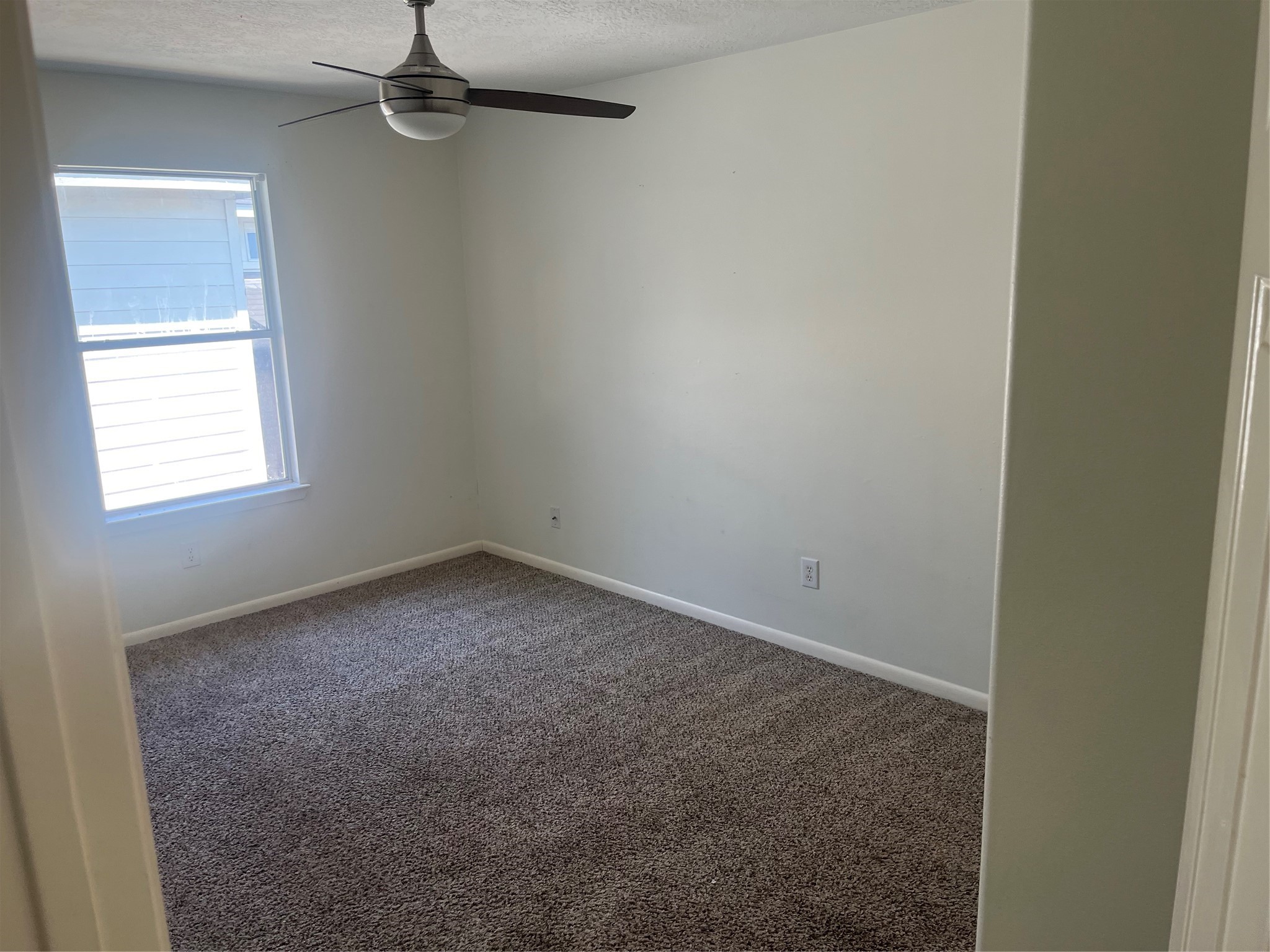 19638 Perth Meadows Court Katy, TX 77449 - Photo 7 of 13 an empty room with a window