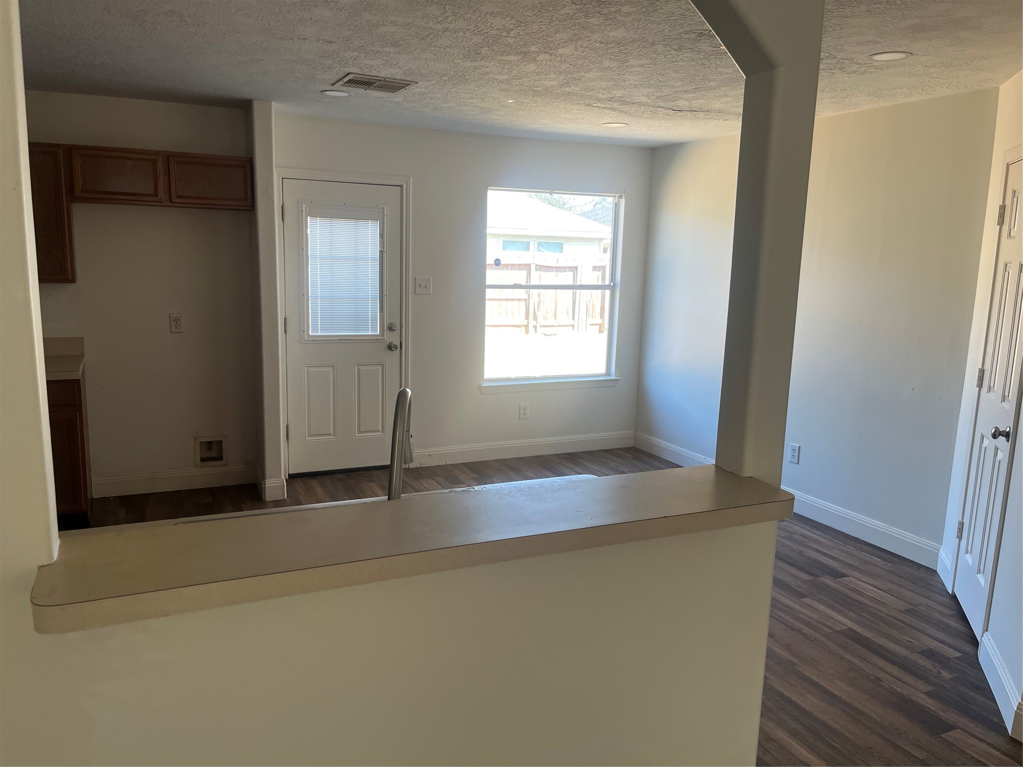 19638 Perth Meadows Court Katy, TX 77449 - Photo 10 of 13 an empty room with wooden floor and windows