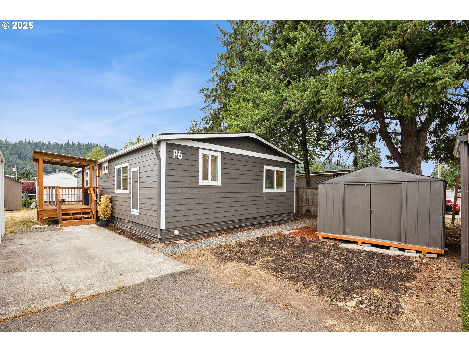 10701 Southeast Highway 212, Unit P6 Clackamas, OR 97015 - Photo 1 of 42 a backyard of a house