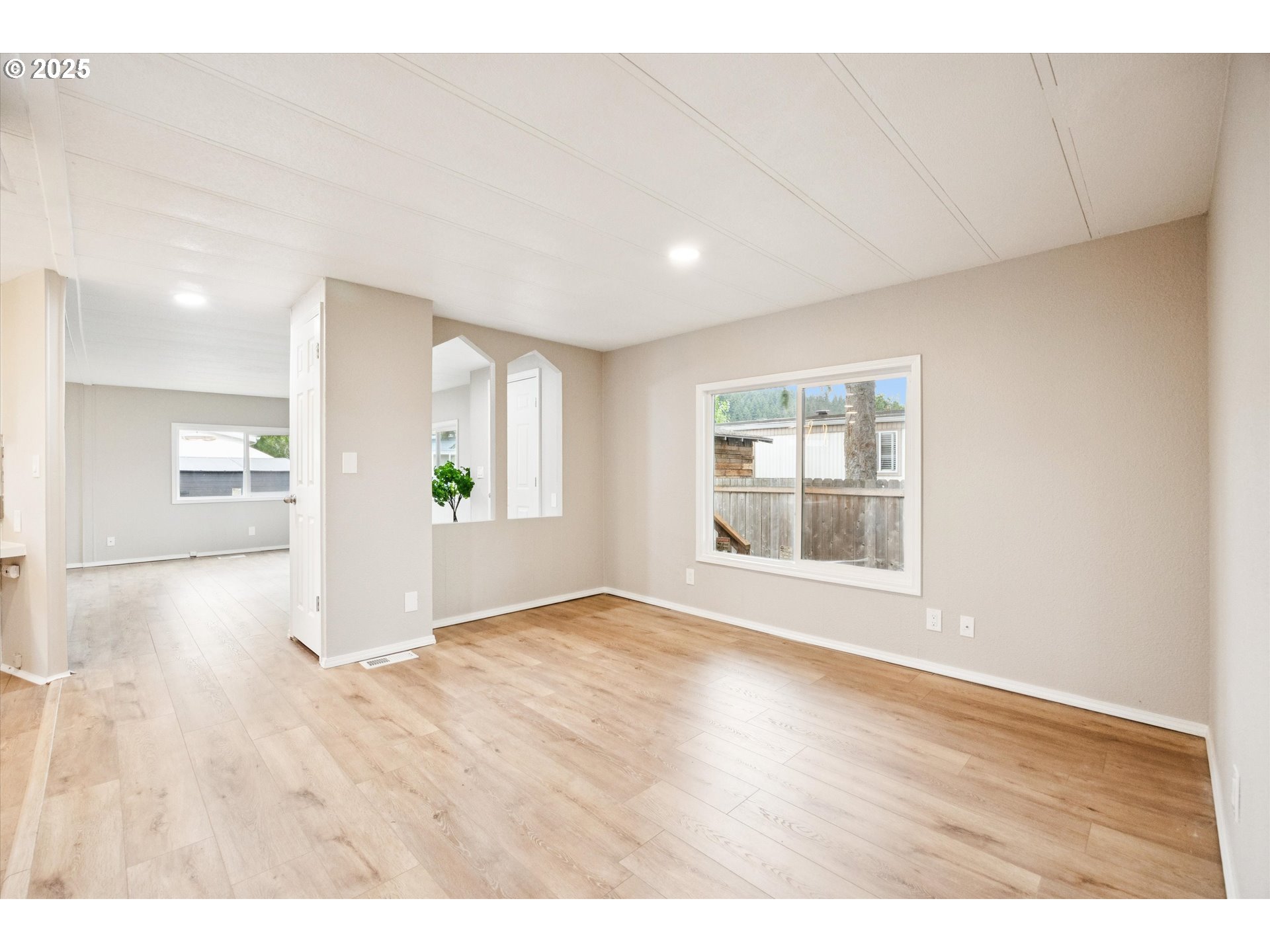 10701 Southeast Highway 212, Unit P6 Clackamas, OR 97015 - Photo 16 of 42 a view of empty room with wooden floor