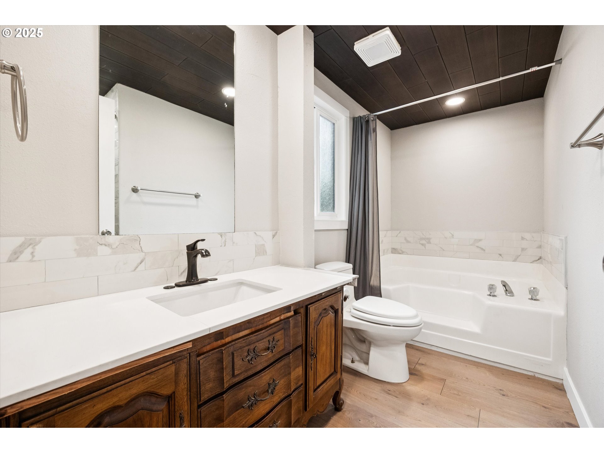 10701 Southeast Highway 212, Unit P6 Clackamas, OR 97015 - Photo 21 of 42 a bathroom with a sink and a mirror