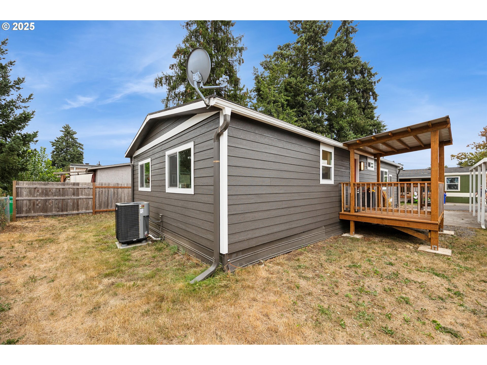 10701 Southeast Highway 212, Unit P6 Clackamas, OR 97015 - Photo 30 of 42 a view of a house with a yard