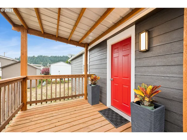 a view of a kitchen with a sink and a potted plant
