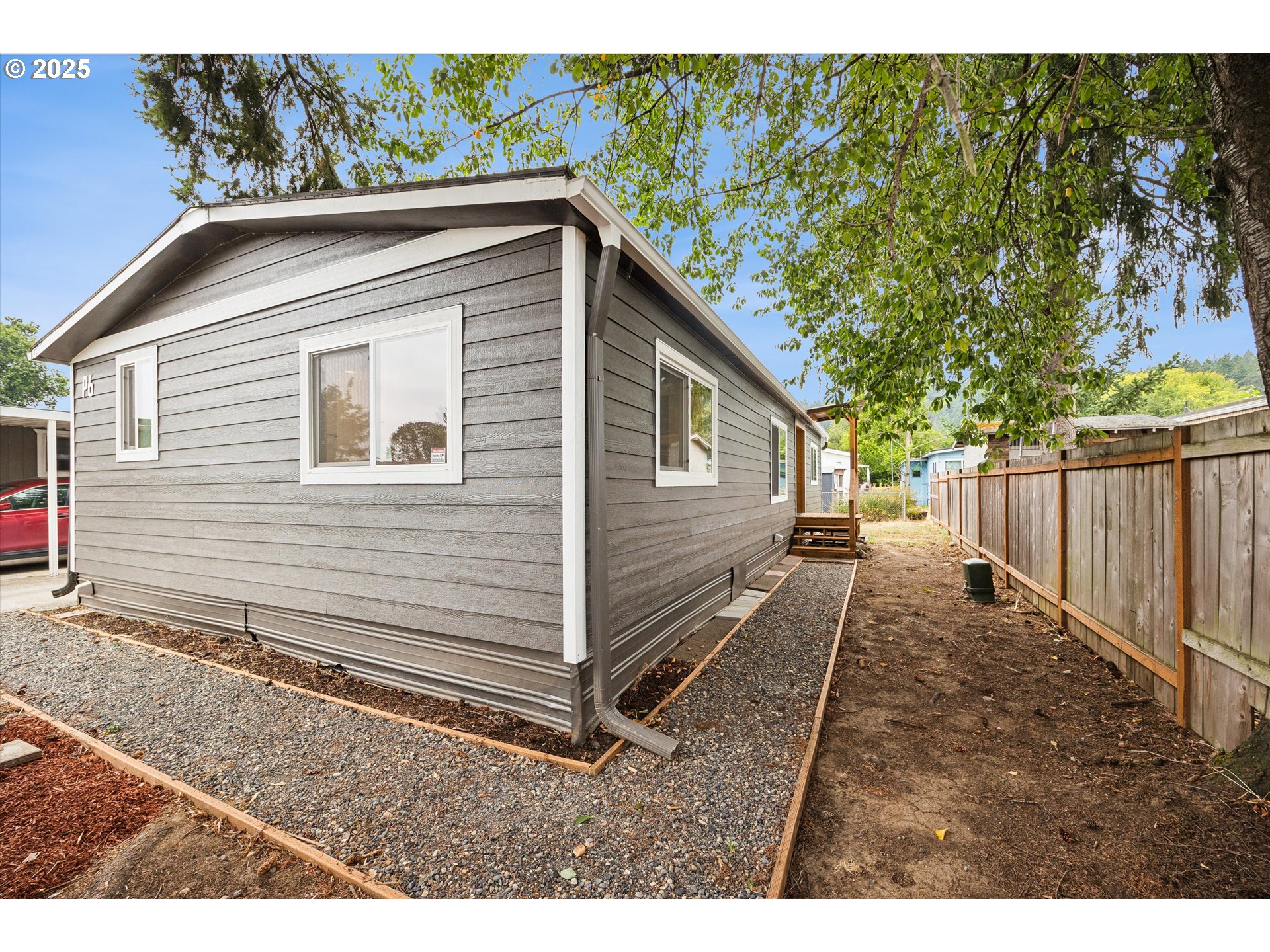 10701 Southeast Highway 212, Unit P6 Clackamas, OR 97015 - Photo 32 of 42 a house view with a backyard space