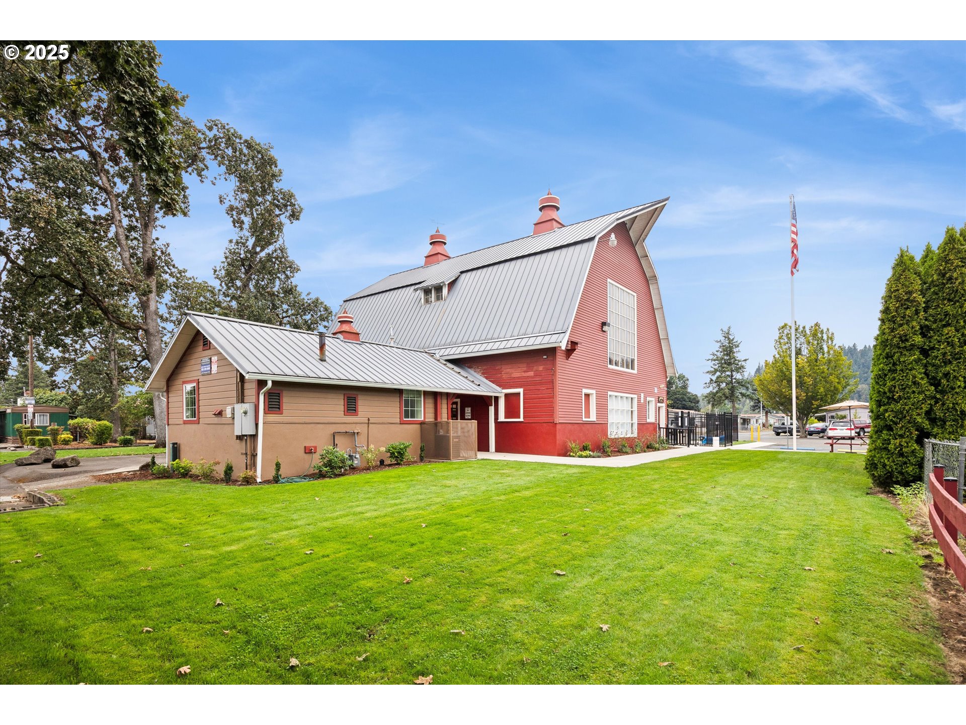10701 Southeast Highway 212, Unit P6 Clackamas, OR 97015 - Photo 34 of 42 a view of a house with a big yard and large trees