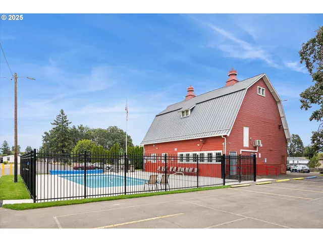 a view of a park with iron fence