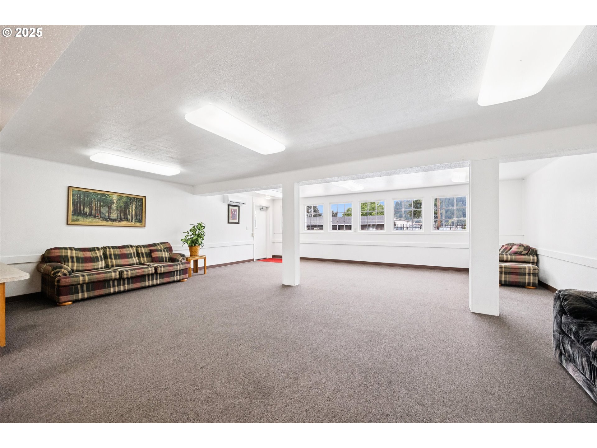 10701 Southeast Highway 212, Unit P6 Clackamas, OR 97015 - Photo 40 of 42 a living room with furniture and a window
