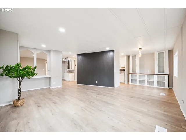 a view of an empty room and a window