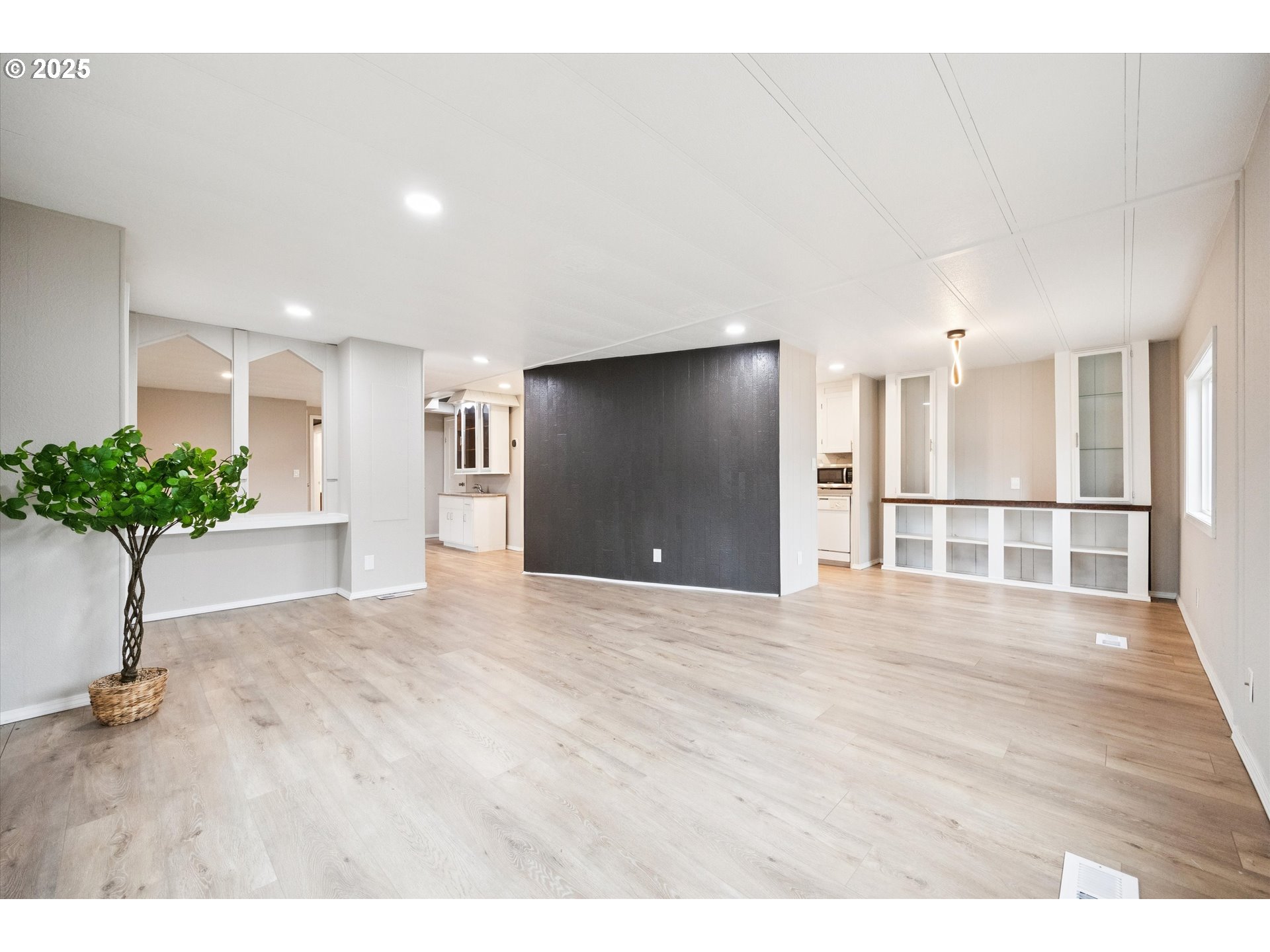 10701 Southeast Highway 212, Unit P6 Clackamas, OR 97015 - Photo 4 of 42 a view of a kitchen with a sink and a potted plant