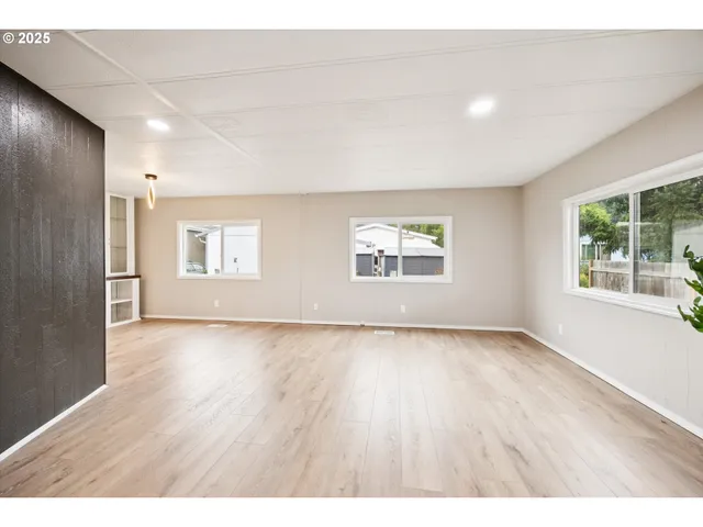 a view interior of a house with wooden floor and windows