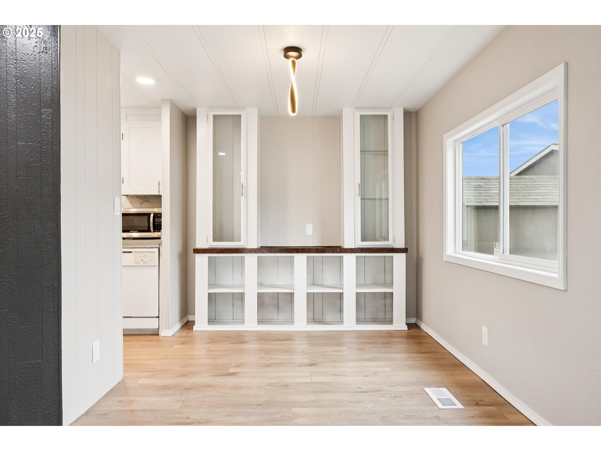 10701 Southeast Highway 212, Unit P6 Clackamas, OR 97015 - Photo 8 of 42 a view interior of a house with wooden floor and windows