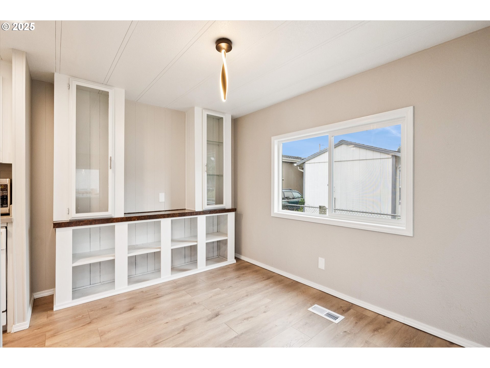 10701 Southeast Highway 212, Unit P6 Clackamas, OR 97015 - Photo 9 of 42 a view of an empty room with a window