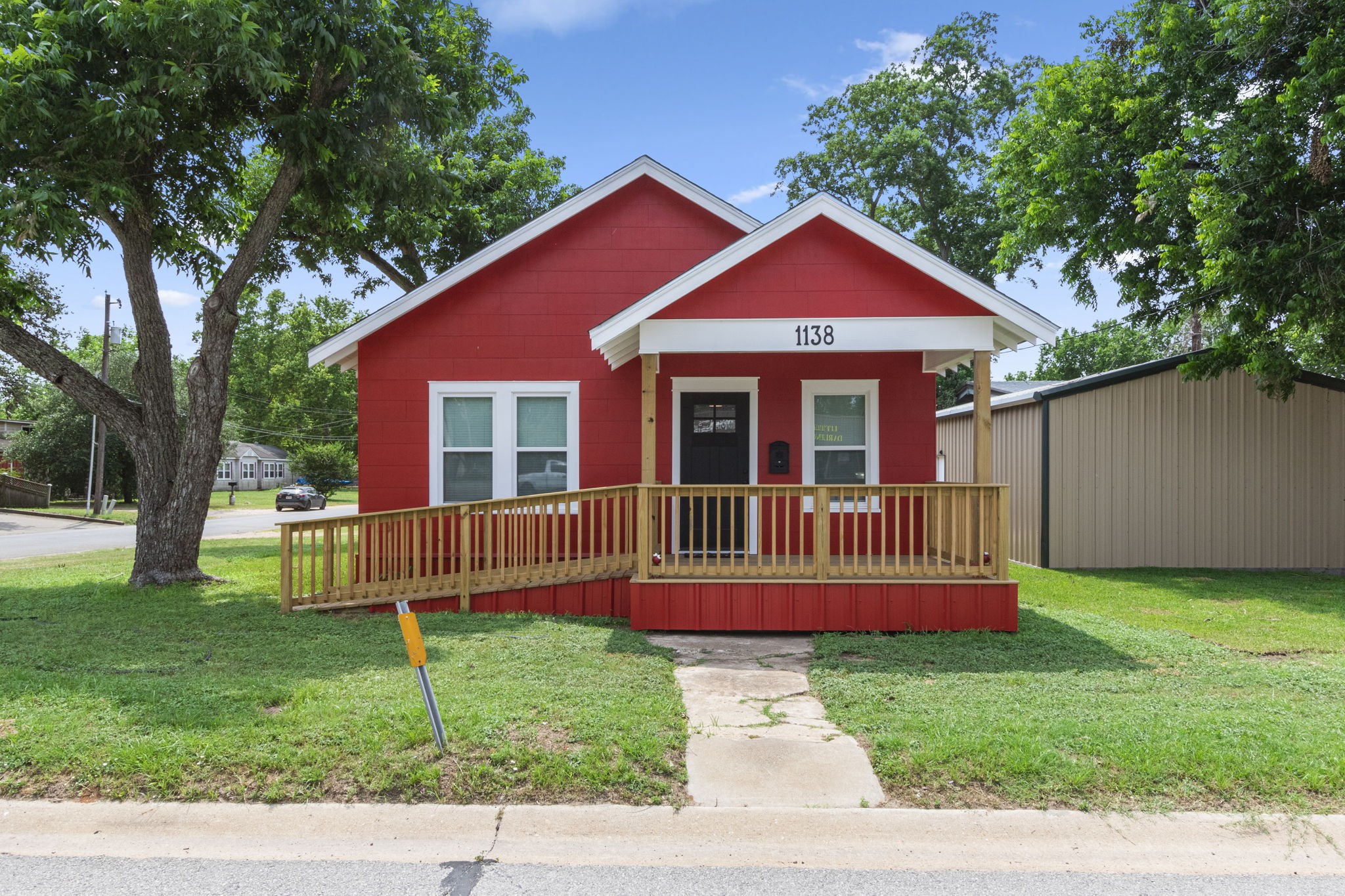 front view of a house with a yard