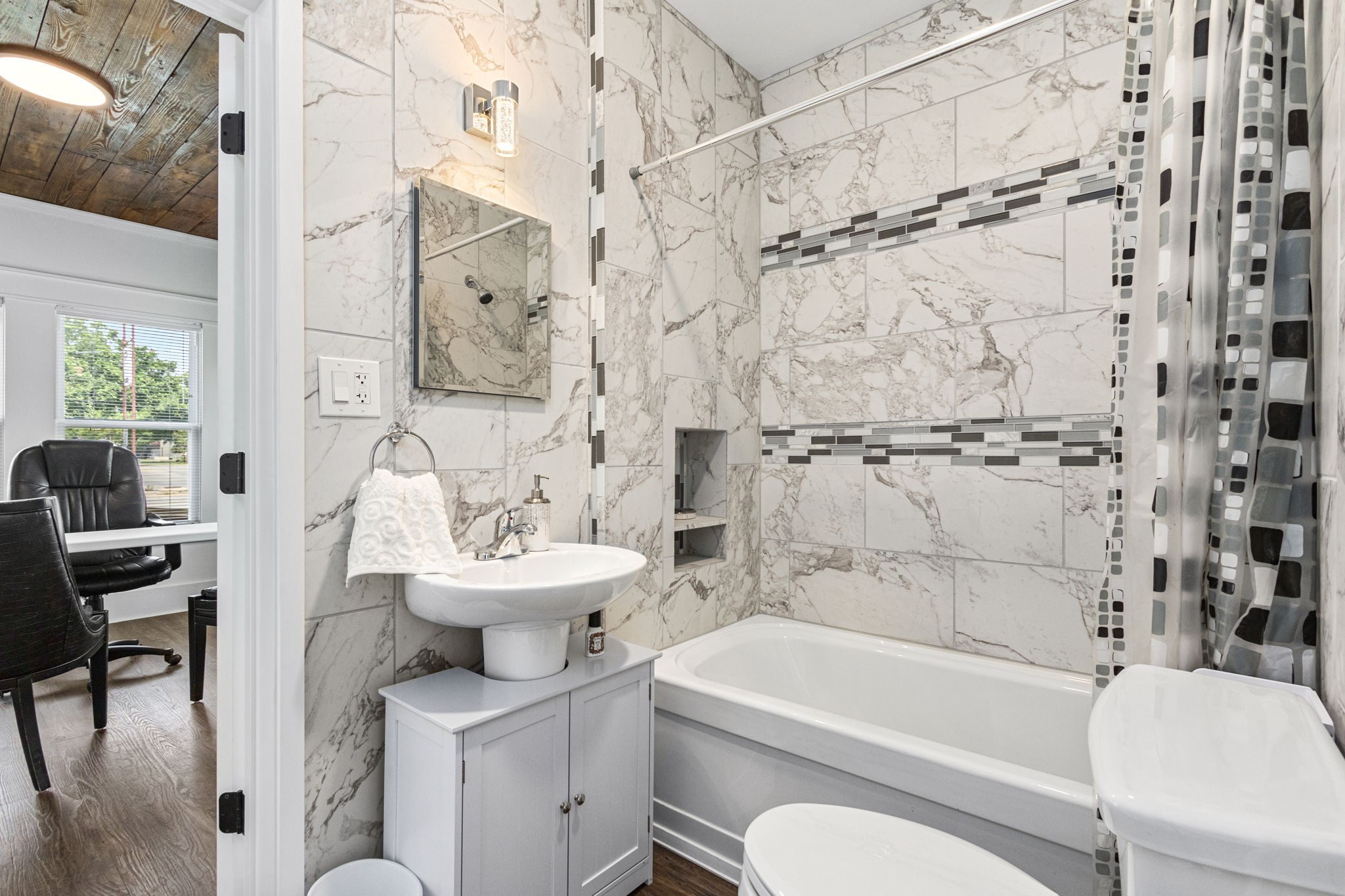 1138 Fannin Street Columbus, TX 78934 - Photo 15 of 25 a bathroom with a sink toilet a mirror and shower