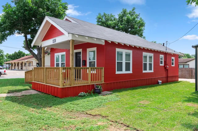 a front view of a house with garden