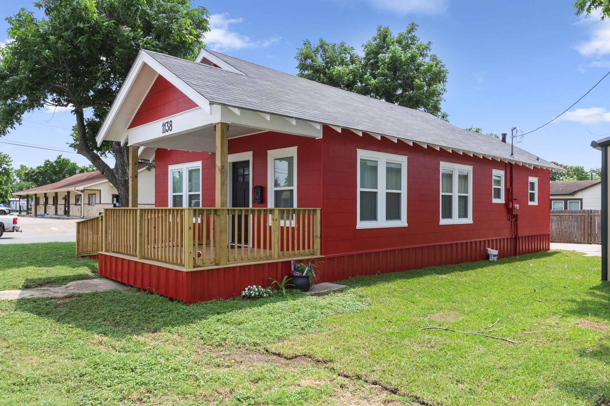 1138 Fannin Street Columbus, TX 78934 - Photo 19 of 25 a front view of a house with garden