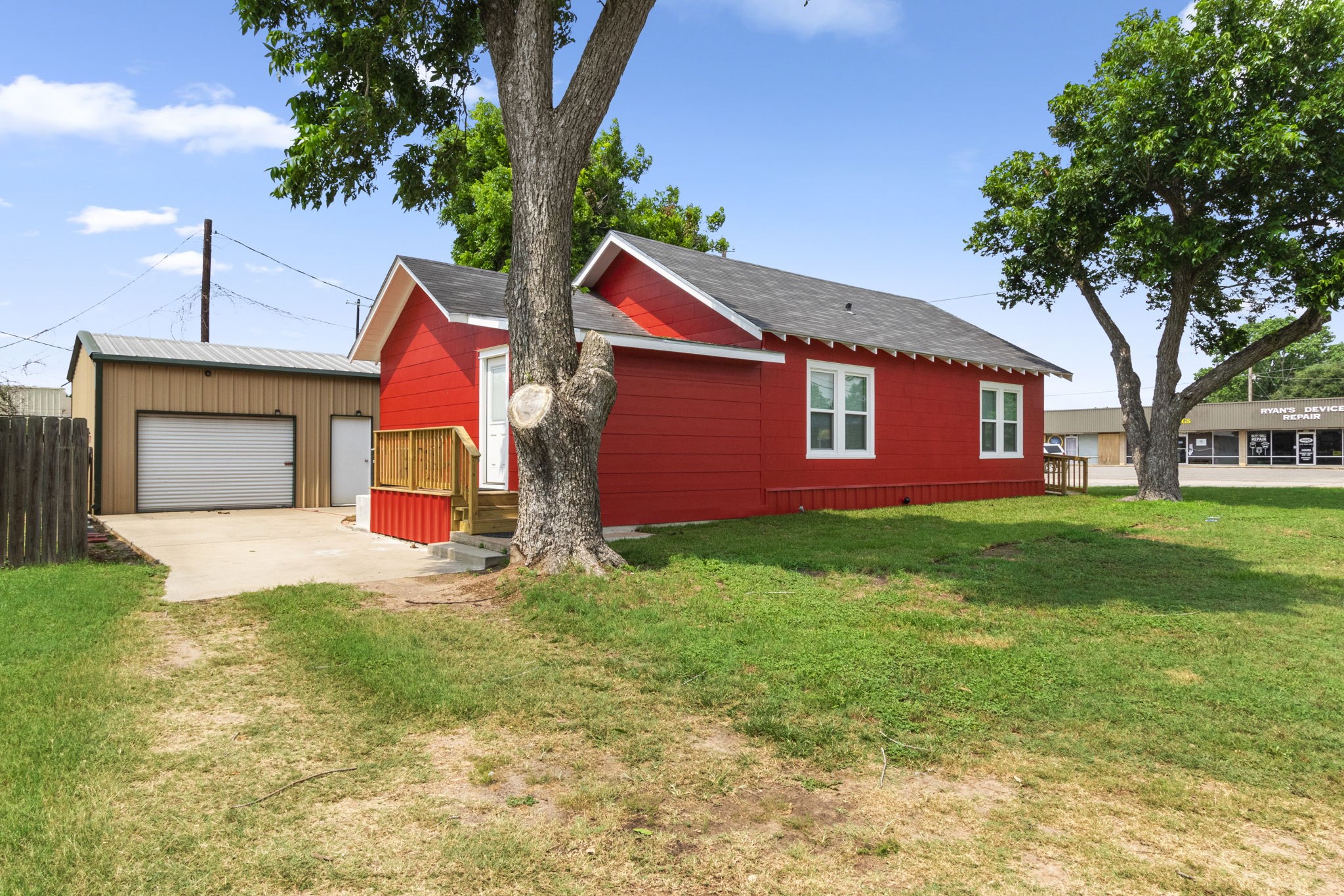 1138 Fannin Street Columbus, TX 78934 - Photo 22 of 25 a front view of a house with a yard