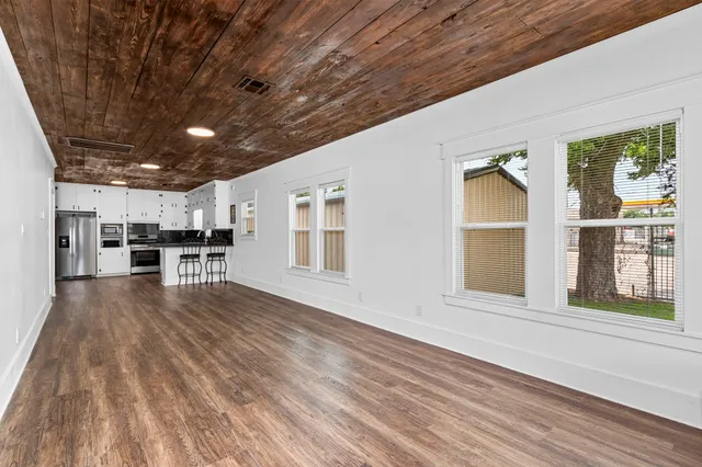 a view of livingroom with furniture wooden floor and window