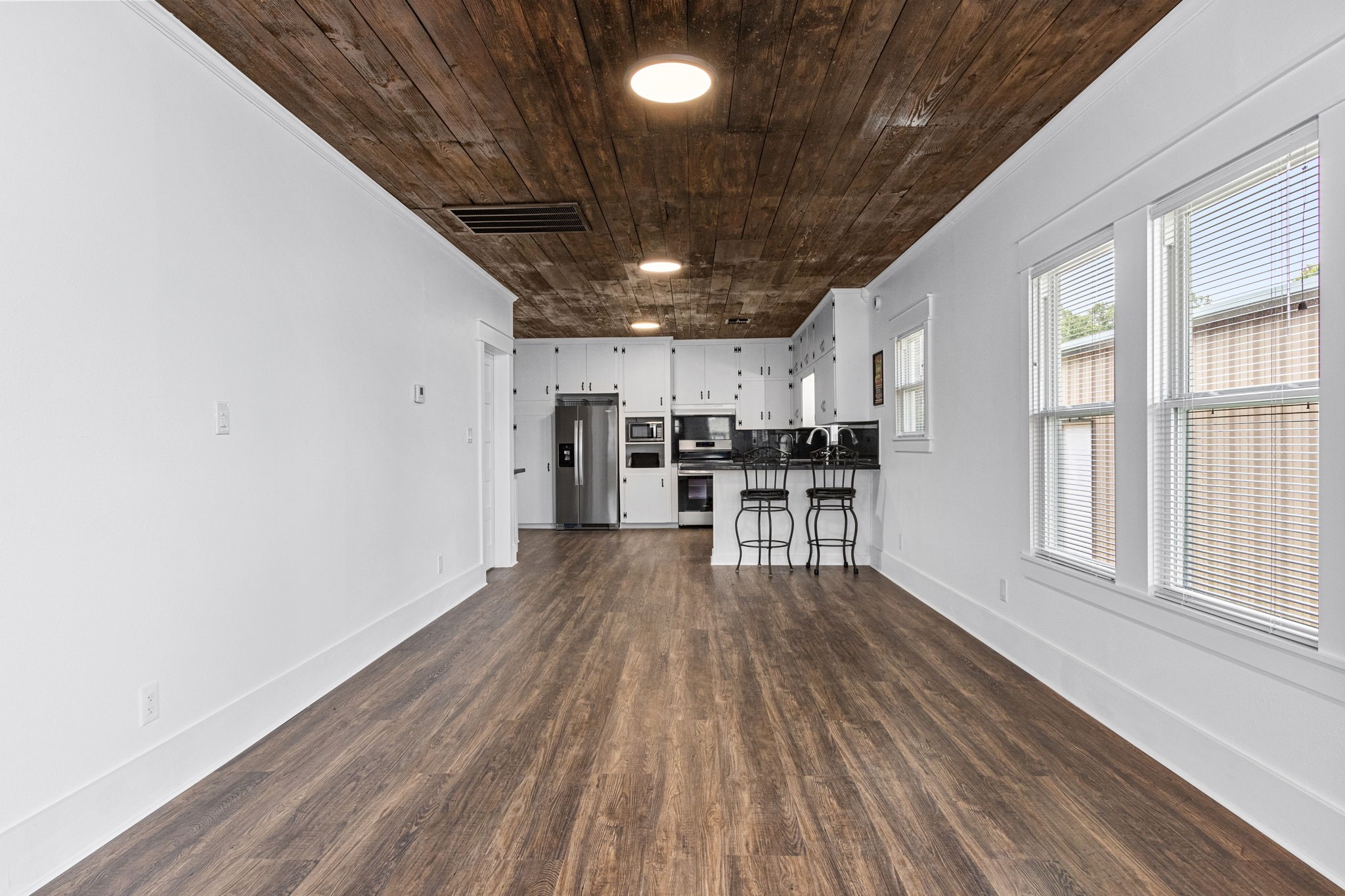 1138 Fannin Street Columbus, TX 78934 - Photo 5 of 25 a view of kitchen with cabinets and wooden floor