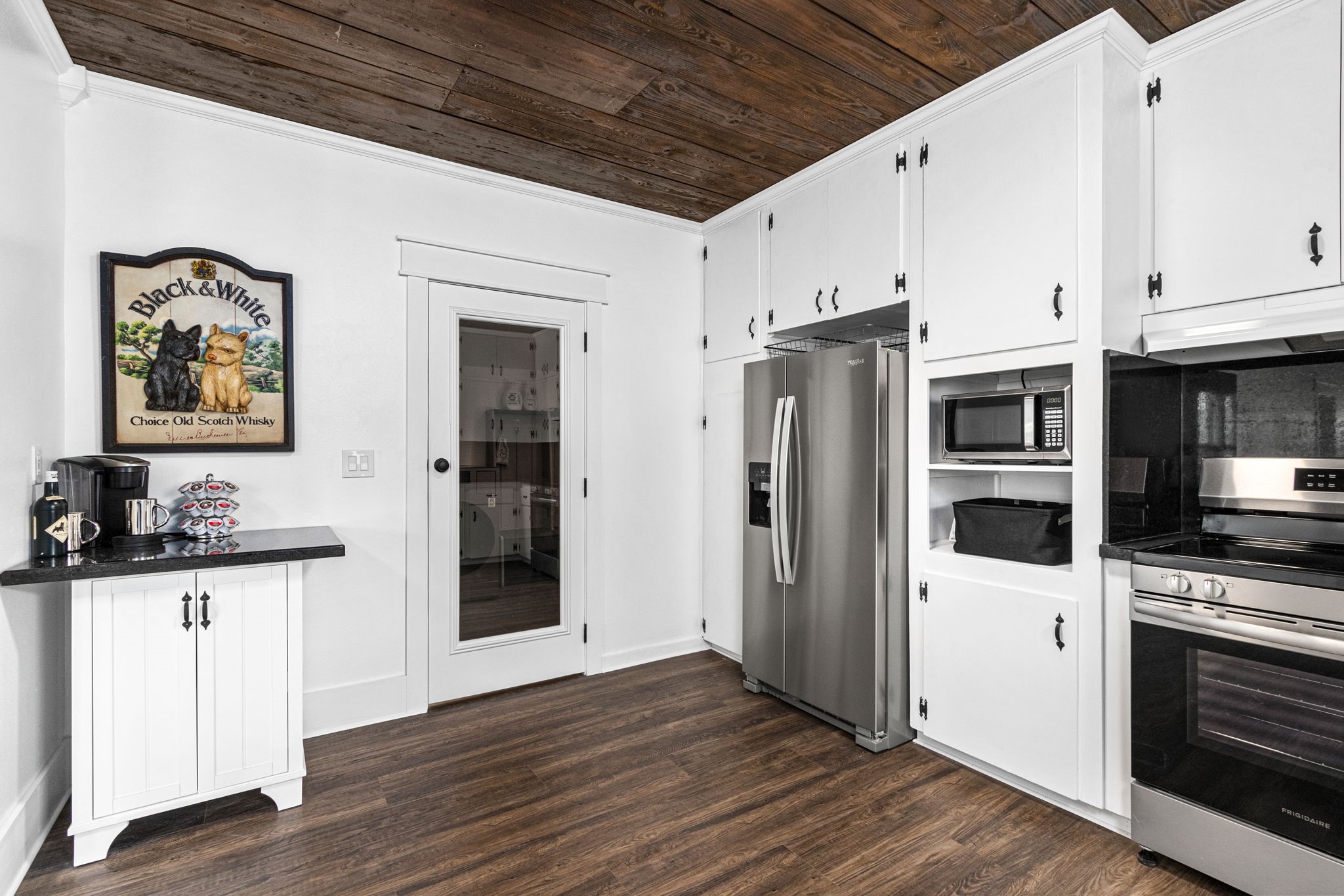 1138 Fannin Street Columbus, TX 78934 - Photo 10 of 25 a kitchen with stainless steel appliances a refrigerator and a stove top oven