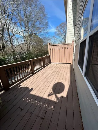 a view of balcony with wooden floor