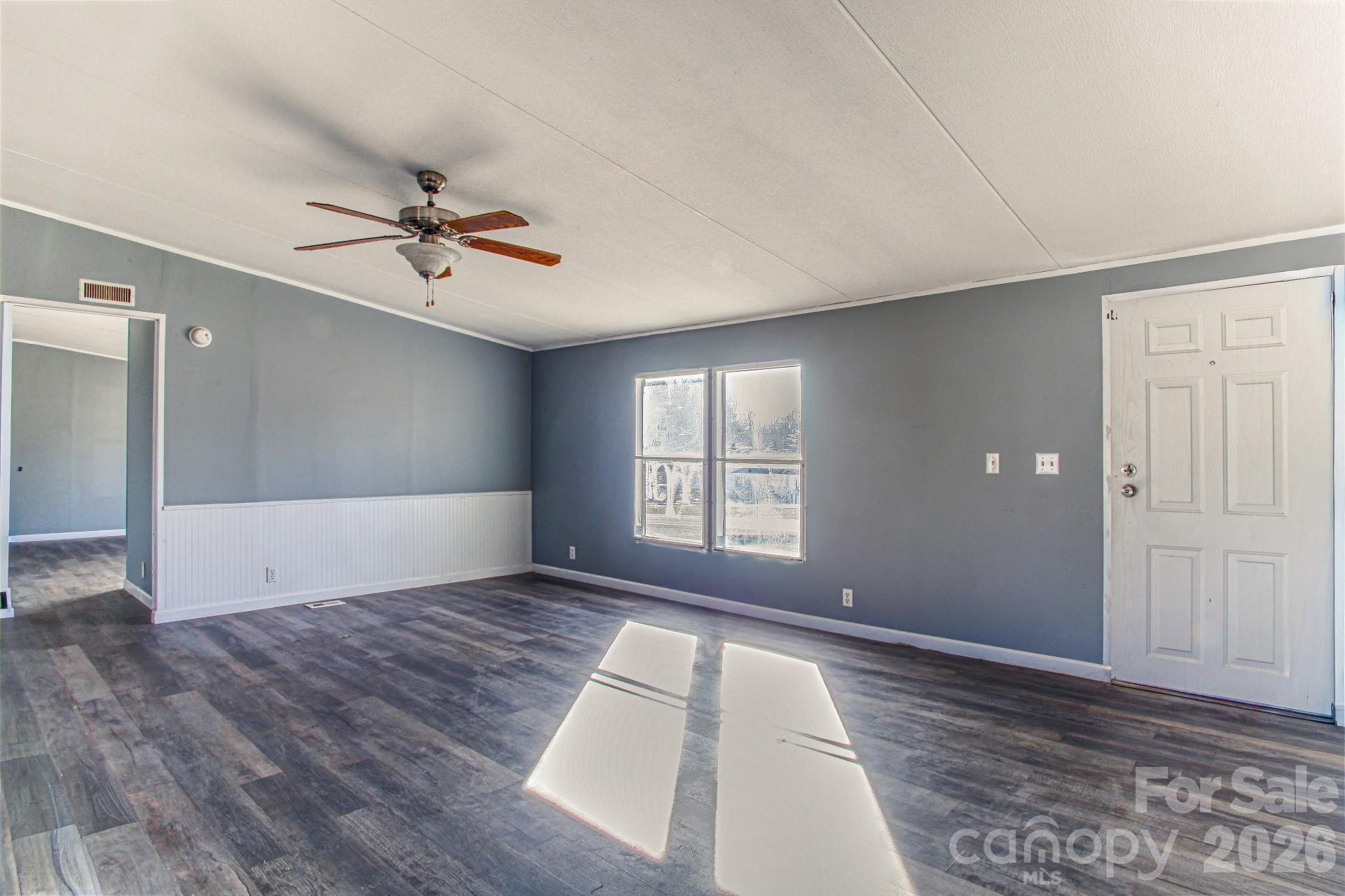4610 Deal Road Claremont, NC 28610 - Photo 11 of 13 a view of empty room with wooden floor and fan