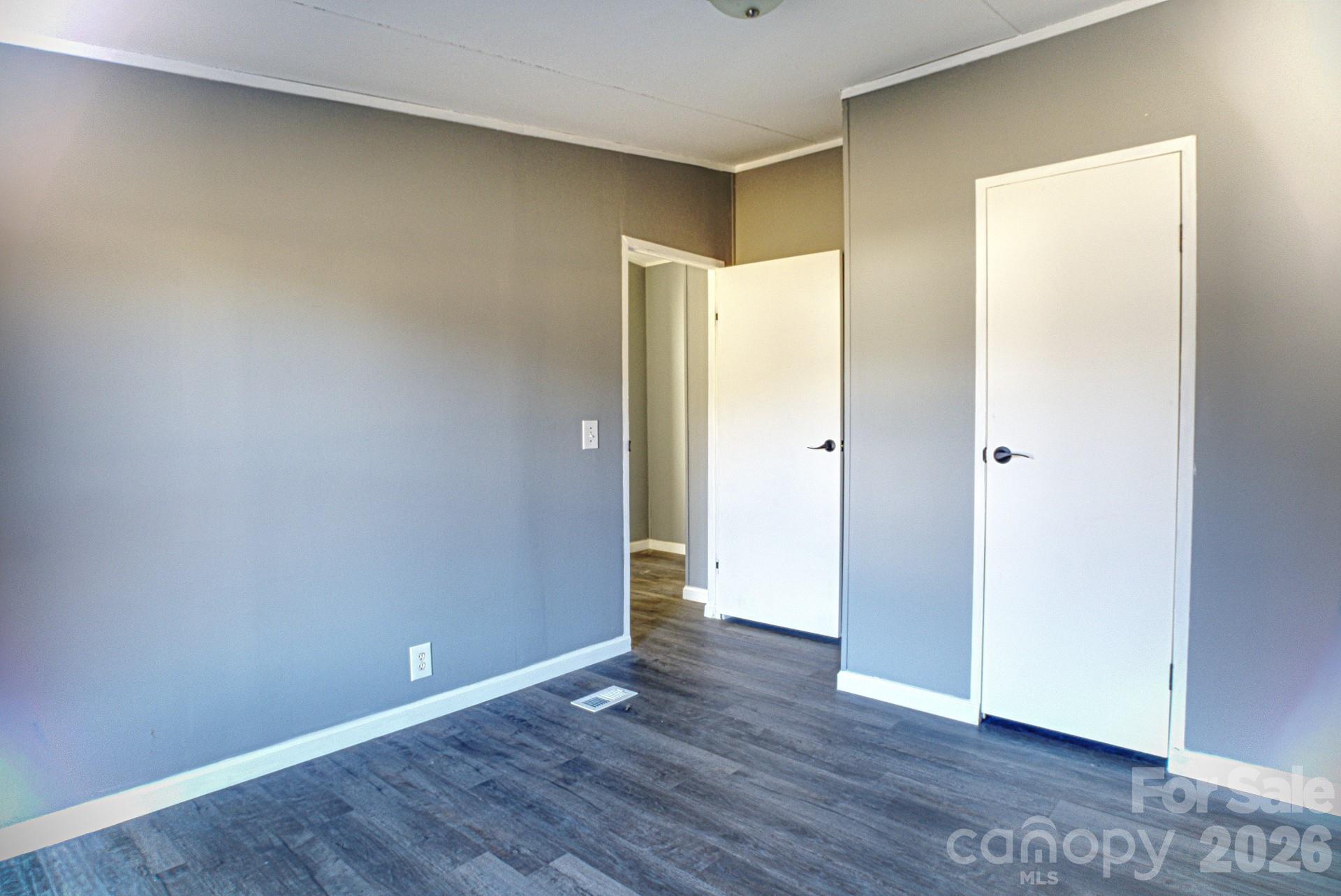 4610 Deal Road Claremont, NC 28610 - Photo 6 of 13 an empty room with wooden floor and closet