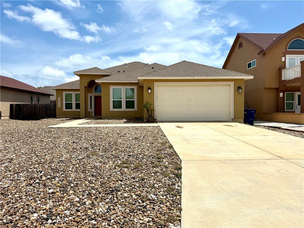 14510 Dragonet Street Corpus Christi, TX 78418 - Photo 1 of 19 a front view of a house with a yard