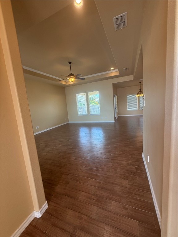 14510 Dragonet Street Corpus Christi, TX 78418 - Photo 3 of 19 an empty room with wooden floor and windows