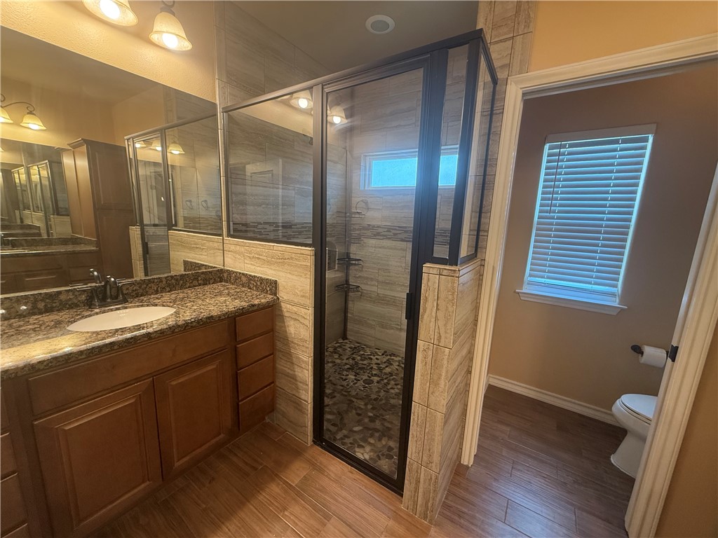 14510 Dragonet Street Corpus Christi, TX 78418 - Photo 9 of 19 a bathroom with double vanity and a shower