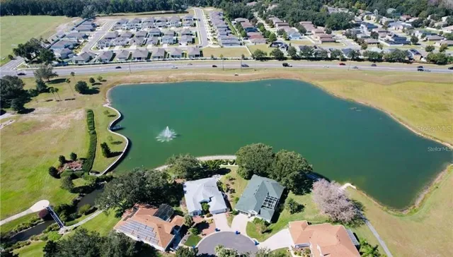 an aerial view of a house with a swimming pool