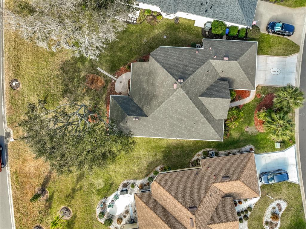 5685 Gulf Stream Street Tavares, FL 32778 - Photo 15 of 78 an aerial view of a house with a yard basket ball court and outdoor seating