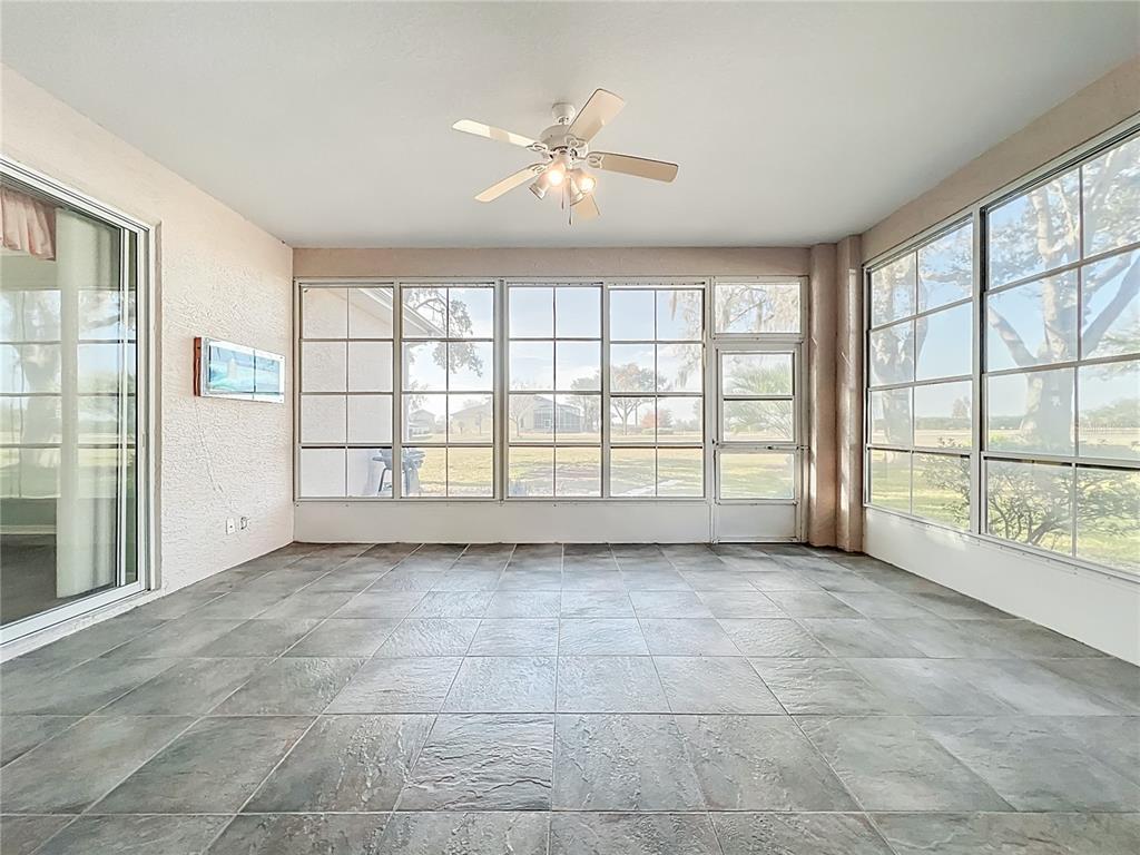 5685 Gulf Stream Street Tavares, FL 32778 - Photo 21 of 78 a view of an empty room with a window