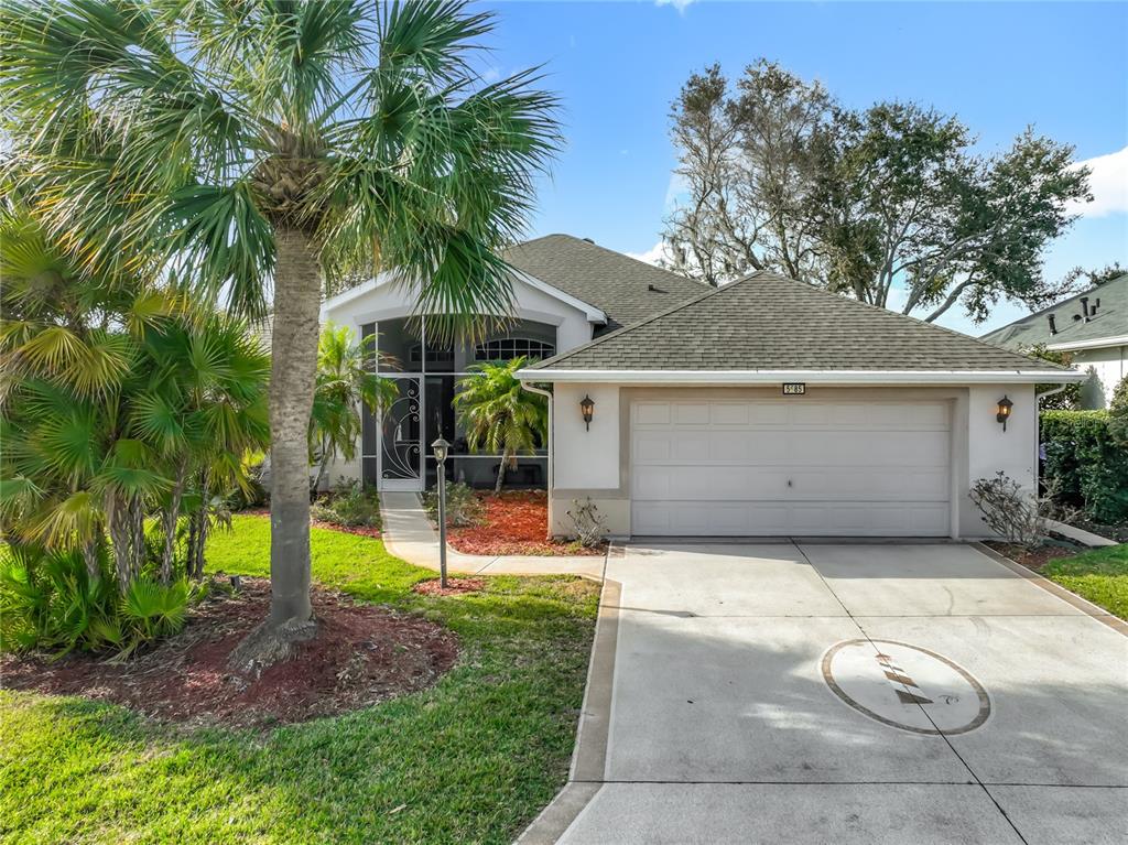 5685 Gulf Stream Street Tavares, FL 32778 - Photo 6 of 78 a view of a backyard with a potted plants and a large tree