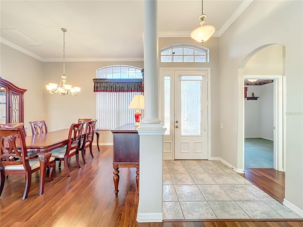 5685 Gulf Stream Street Tavares, FL 32778 - Photo 67 of 78 a view of a a dining room with furniture window and wooden floor